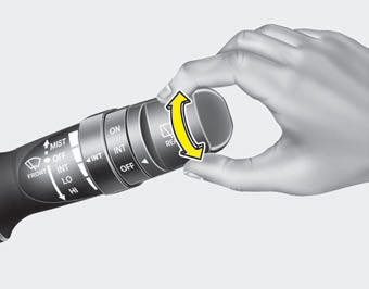 The rear window wiper and washer switch is located at the end of the wiper and