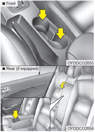 Cups or small beverage cans may be placed in the cup holders.