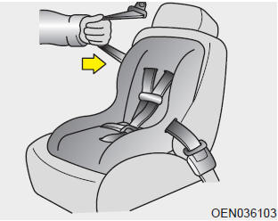 4. Slowly allow the shoulder portion of the seat belt to retract and listen for